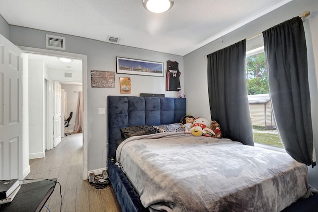 17891 N 86th St N, The Acreage, FL 33470 - bedroom with wood finished floors and baseboards