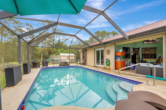 view of pool featuring a lanai and a patio