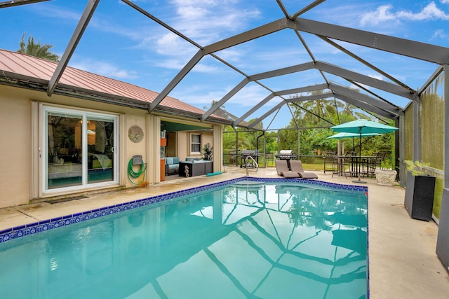 17891 N 86th St N, The Acreage, FL 33470 - swimming pool featuring a patio area, outdoor lounge area, glass enclosure, and outdoor dining space