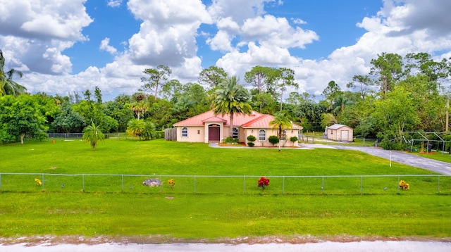 17891 N 86th St N, The Acreage, FL 33470 - mediterranean / spanish-style home featuring driveway, metal roof, and view of wooded area