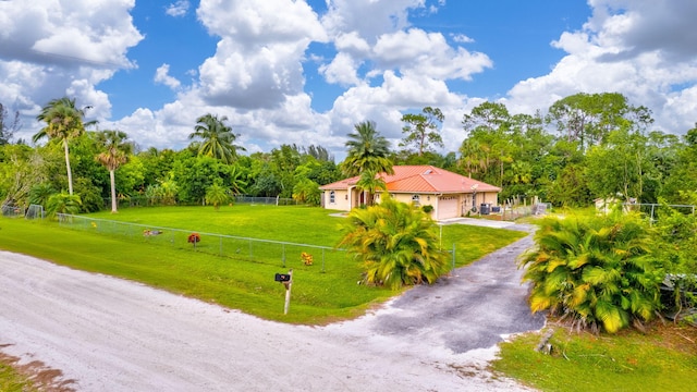 17891 N 86th St N, The Acreage, FL 33470 - view of front facade with dirt driveway, a garage, and view of scattered trees