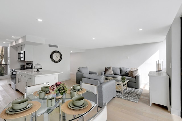 living room with light hardwood / wood-style floors