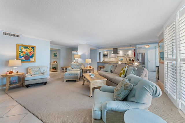 living room featuring a textured ceiling, light tile flooring, and ornamental molding