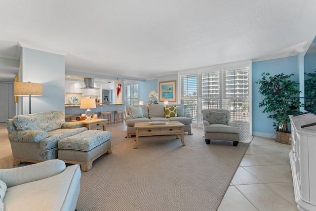 tiled living room featuring crown molding and a textured ceiling