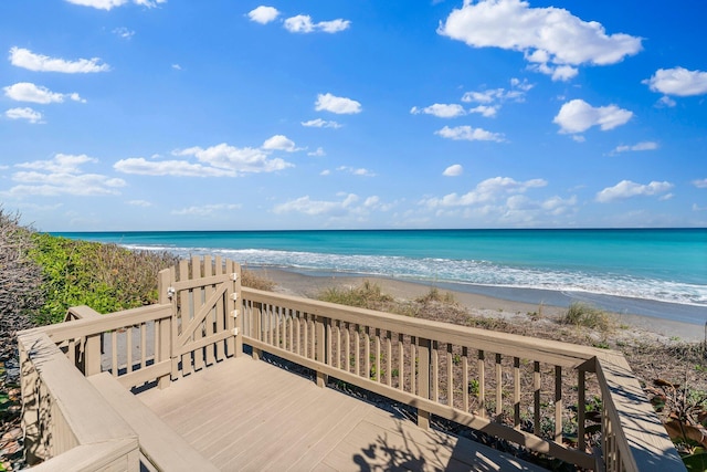 exterior space with a beach view and a water view