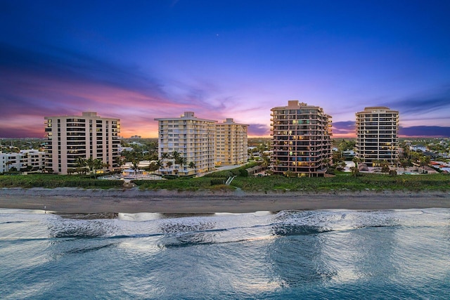 aerial view at dusk with a water view