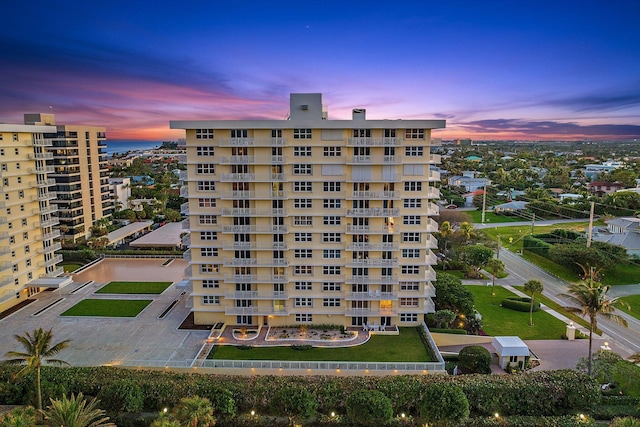 view of outdoor building at dusk