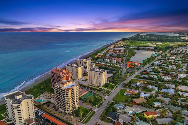 aerial view at dusk with a water view