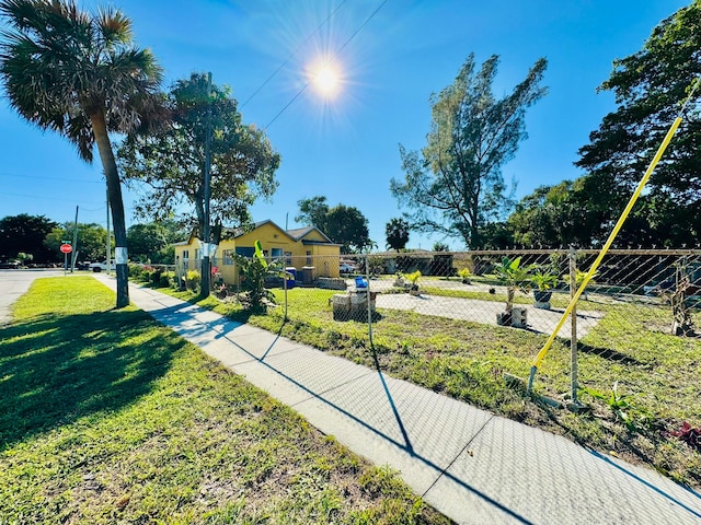 view of home's community featuring a lawn