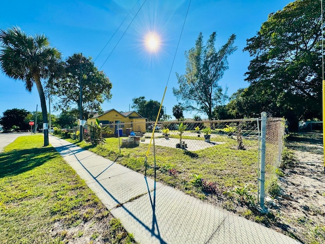 view of property's community with a lawn