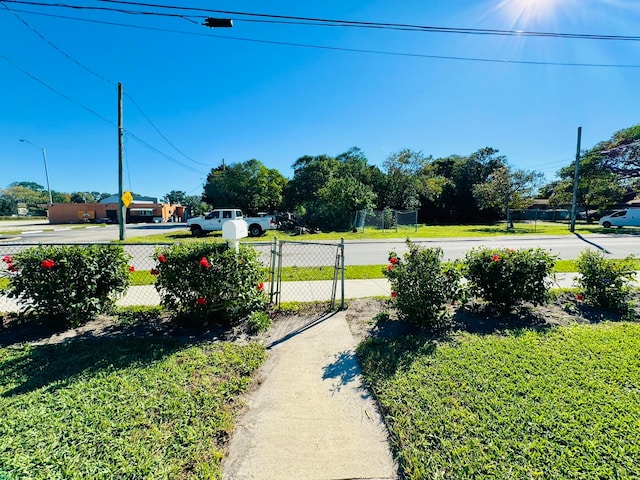 view of property's community with a lawn