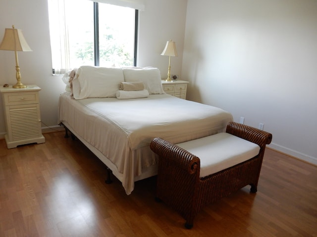 bedroom featuring dark wood-type flooring