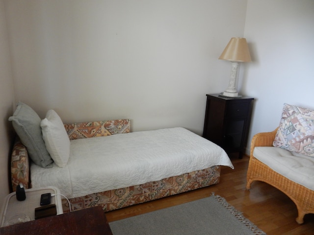 bedroom featuring dark wood-type flooring