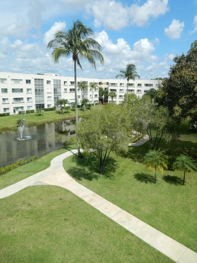 view of nearby features with a water view and a yard