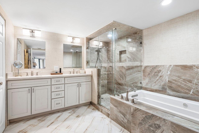 bathroom with tile floors, independent shower and bath, and dual bowl vanity