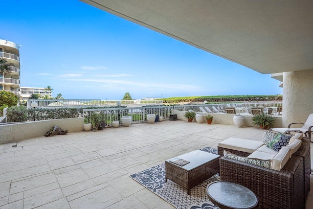 balcony with an outdoor hangout area and a patio area