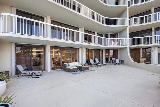 interior space with a balcony and outdoor lounge area