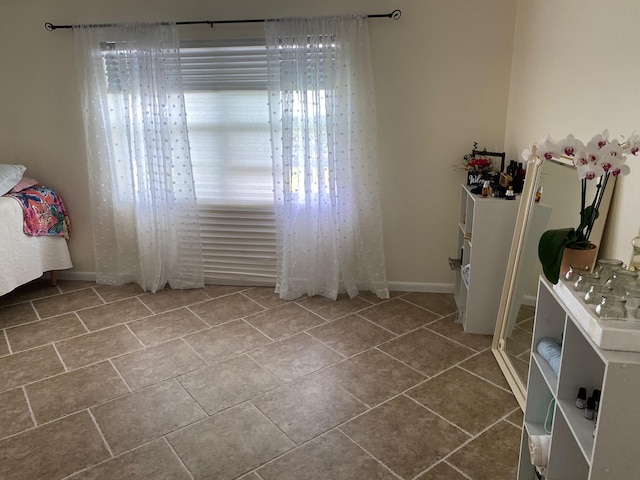 unfurnished bedroom featuring tile flooring