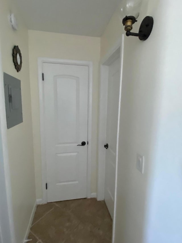 interior space featuring a chandelier and light tile floors