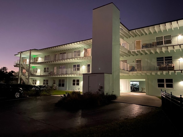 view of outdoor building at dusk