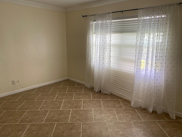 tiled empty room featuring ornamental molding