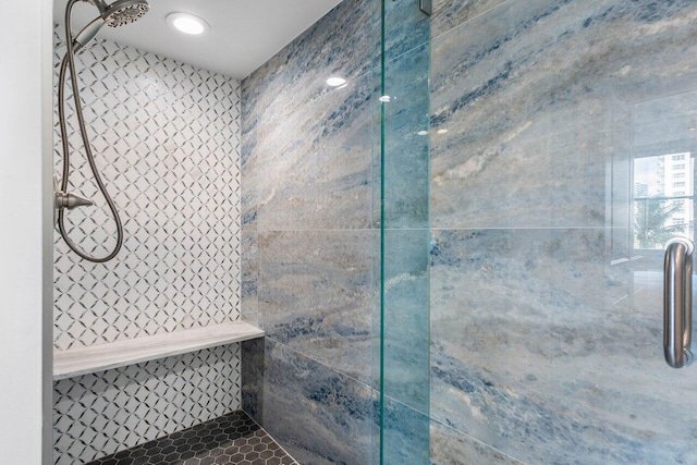 bathroom with tiled shower