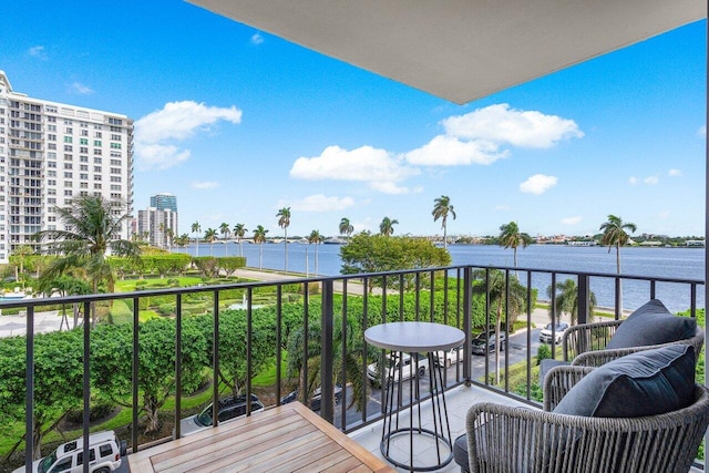 balcony featuring a water view