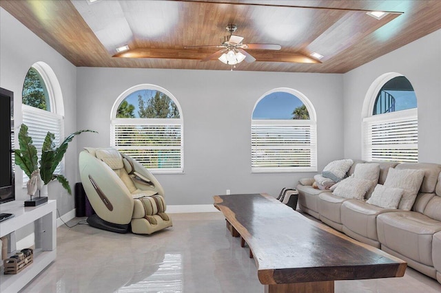 living room featuring light tile floors, ceiling fan, and wooden ceiling