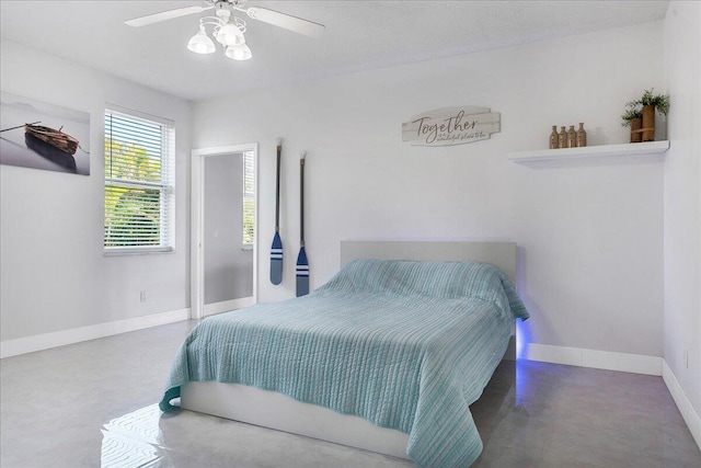 bedroom featuring concrete flooring and ceiling fan