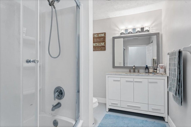 full bathroom featuring vanity, a textured ceiling,  shower combination, and toilet