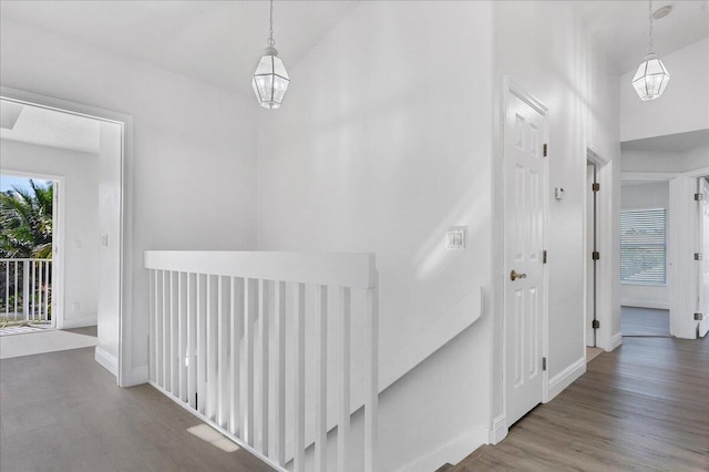 hallway with hardwood / wood-style flooring