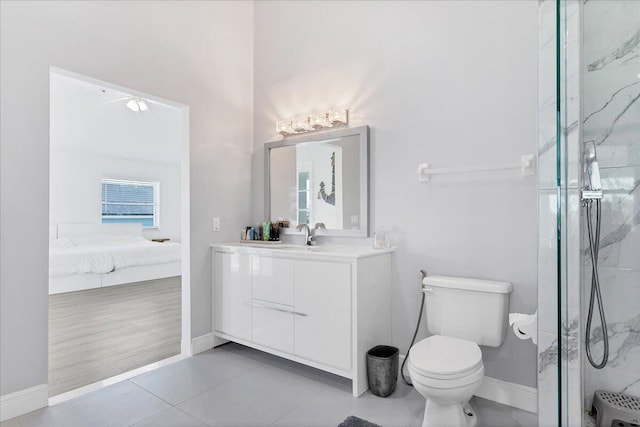 bathroom featuring walk in shower, tile floors, toilet, and vanity