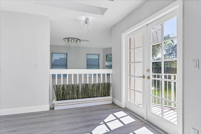 doorway to outside featuring french doors and dark hardwood / wood-style flooring