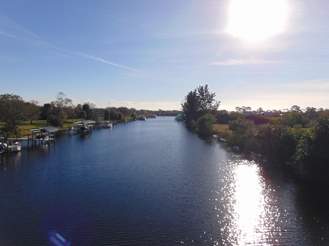 property view of water with a dock