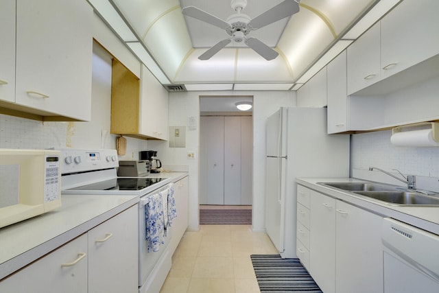 kitchen with white appliances, backsplash, ceiling fan, and light tile floors