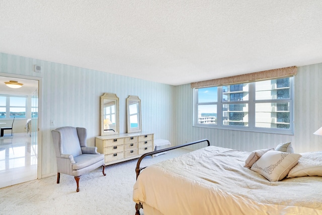 carpeted bedroom with a textured ceiling