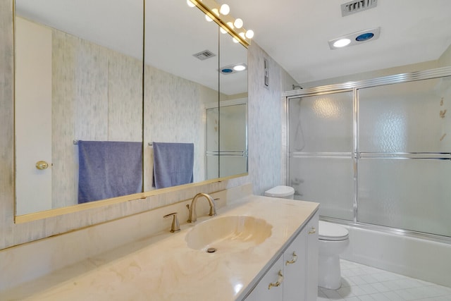 full bathroom with combined bath / shower with glass door, toilet, vanity, and tile flooring