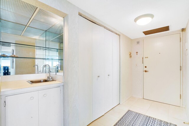 interior space with tile floors and vanity