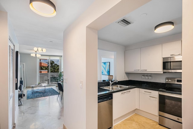 kitchen with white cabinetry, sink, and appliances with stainless steel finishes