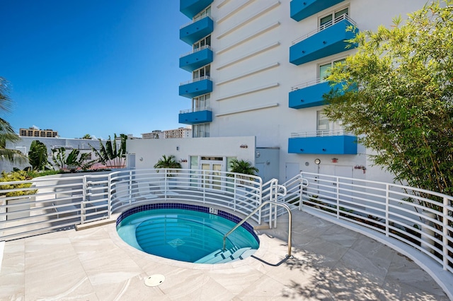 view of pool featuring a community hot tub