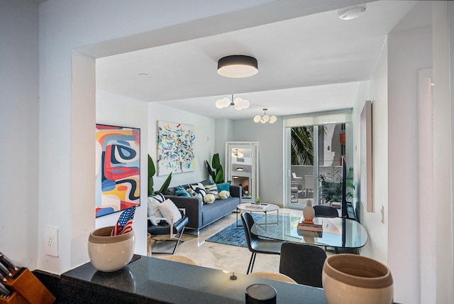 living room featuring a notable chandelier