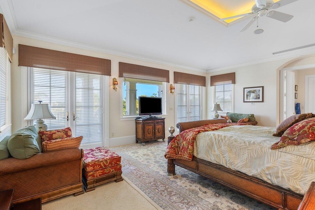 carpeted bedroom with ceiling fan and ornamental molding