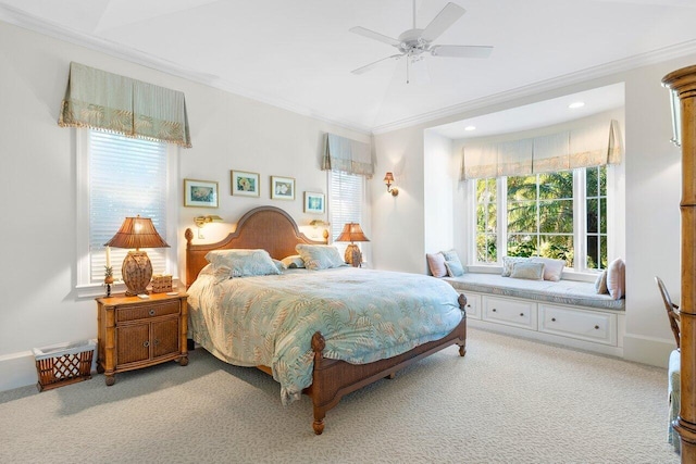 bedroom with light carpet, ornamental molding, and ceiling fan