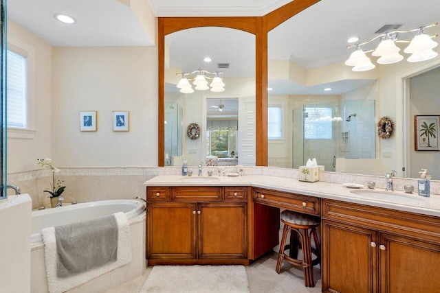 bathroom featuring separate shower and tub, tile floors, a healthy amount of sunlight, and dual vanity