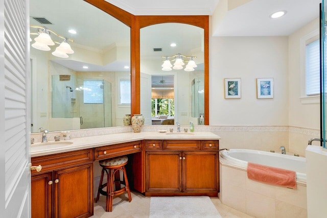 bathroom featuring plenty of natural light, double vanity, tile flooring, and separate shower and tub