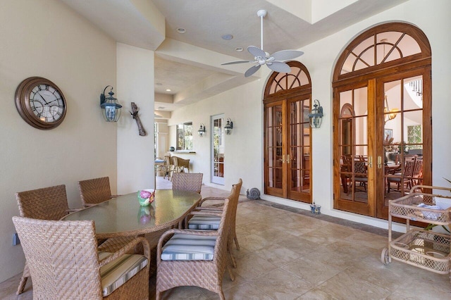 dining room with french doors, plenty of natural light, ceiling fan, and light tile floors