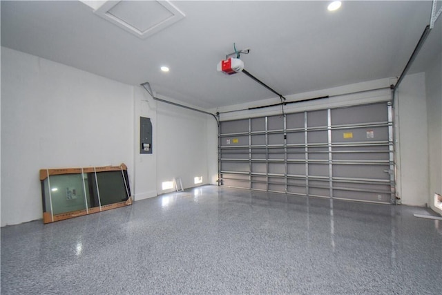 garage featuring a garage door opener and electric panel