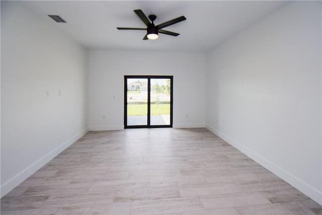 spare room with ceiling fan and light hardwood / wood-style flooring