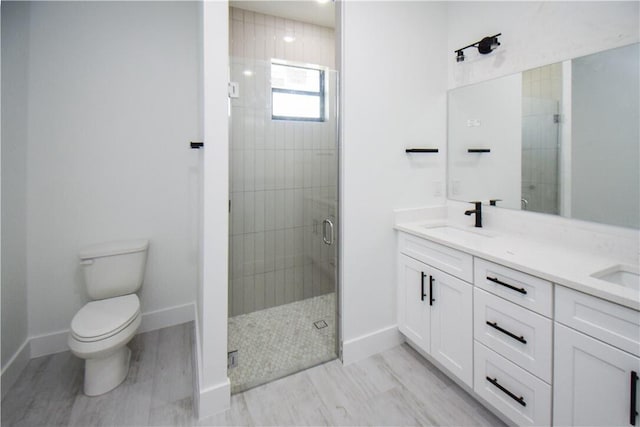 bathroom with an enclosed shower, toilet, and vanity