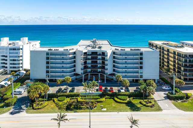 birds eye view of property with a water view